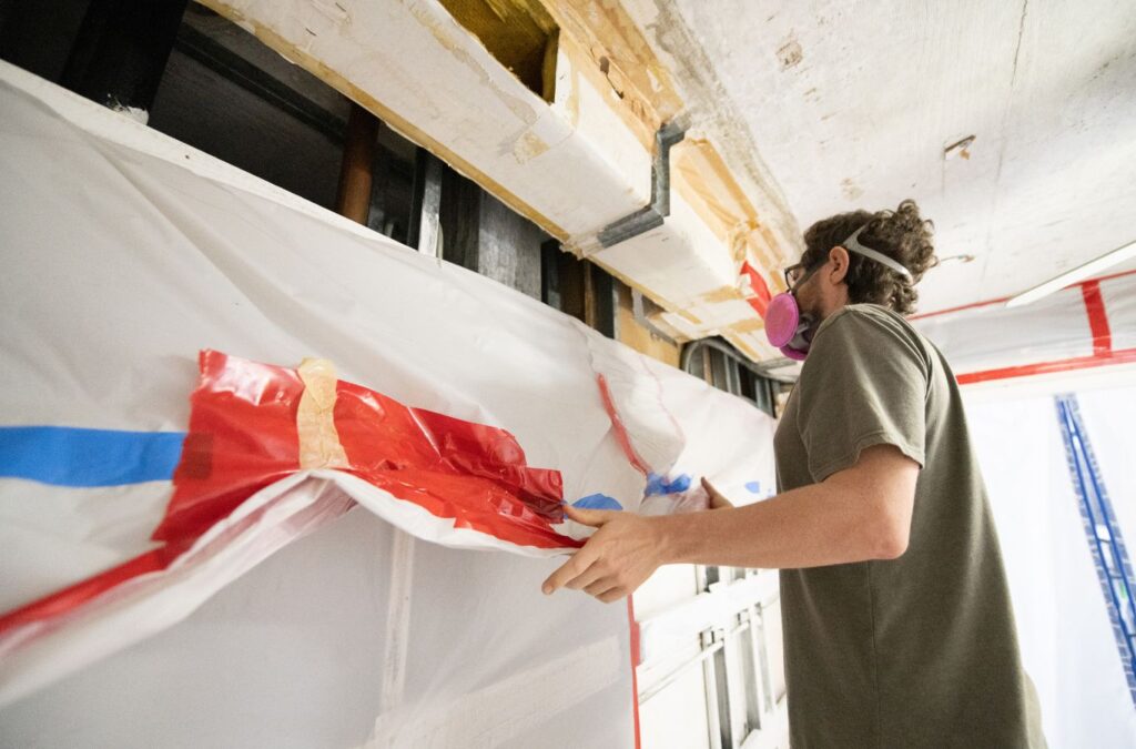 An Endymion Environmental specialist discussing the long-term health benefits and property safety of mold inspections with a Malibu homeowner, highlighting the importance of regular checks.